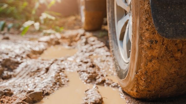 Droom over zinkende auto s in de modder Betekenis