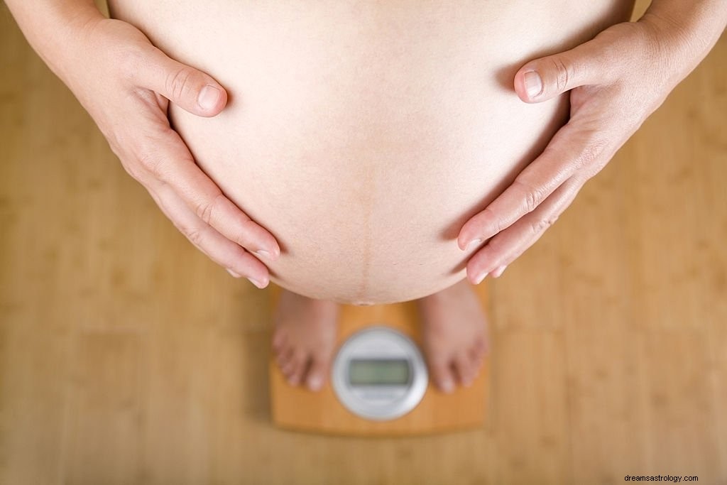 Gravid mage – drømmebetydning og symbolikk
